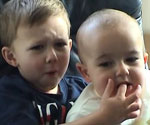Harry Davies-Carr (aged three) and Charlie Davies-Carr (aged one). The two are seen sitting in a chair when Harry puts his finger into Charlie's mouth and gets bitten. "Charlie bit me," 